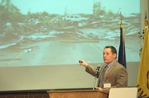 Dr. D. Sean Smith shows photo of tornado ravaged Joplin, MO from 2011.