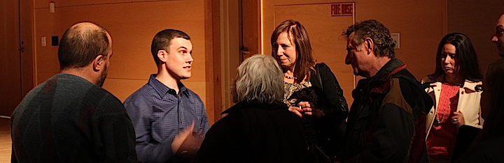 Greg Williams, center, and Audrey Freshman, right, met with audience members after the event.