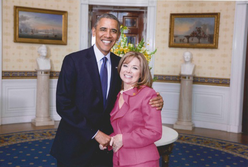 Marguerite Izzo, M.S. '84, with President Barack Obama at the White House.